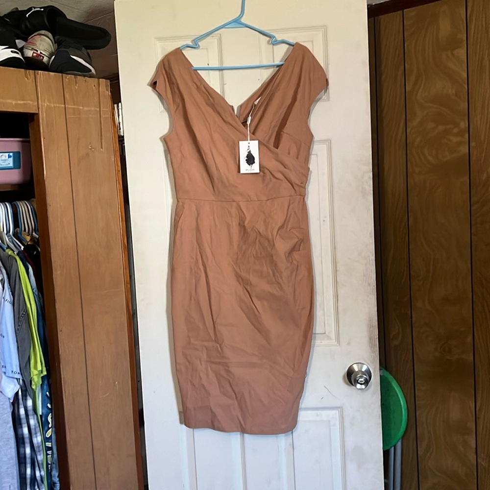 Tan/cream color dress with a few wrinkles